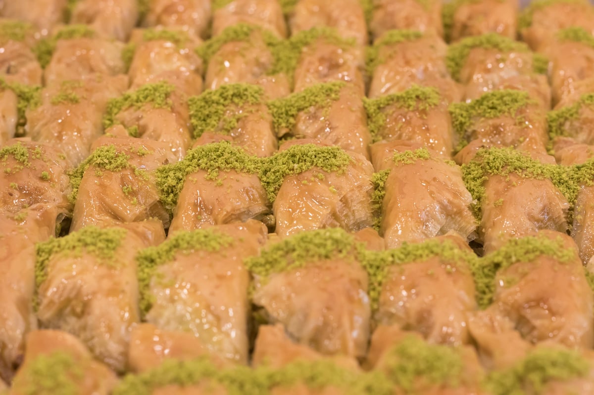Traditional baklava rolls with pistachio and syrup