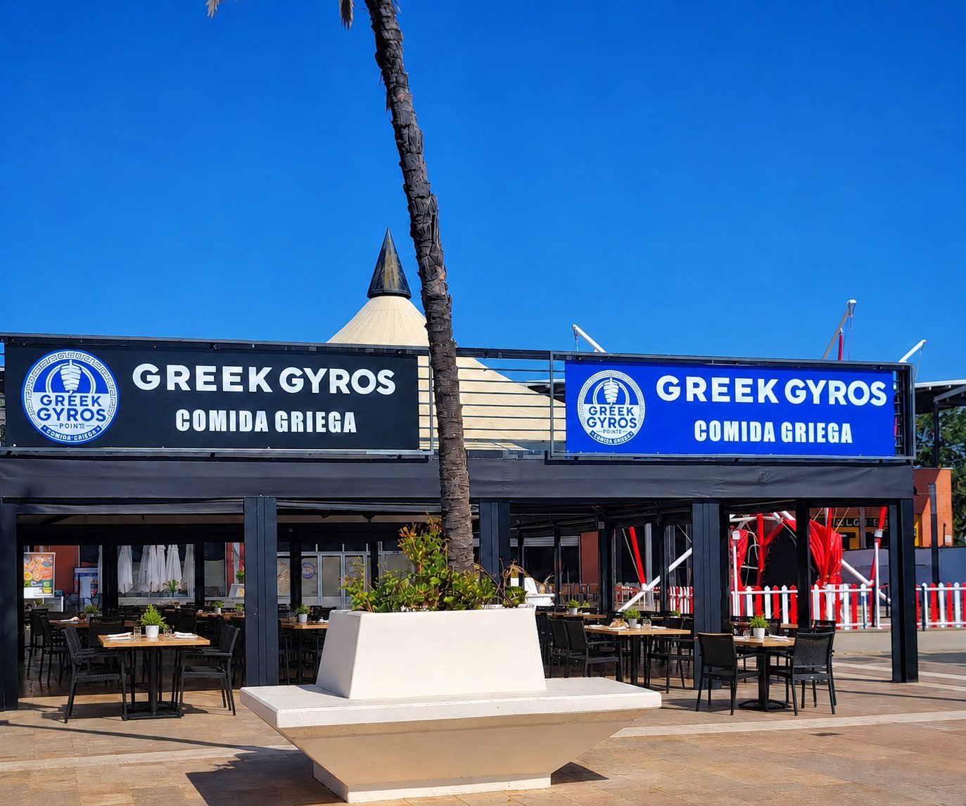 Greek gyros meat on vertical rotisserie with fresh ingredients and Mediterranean food
